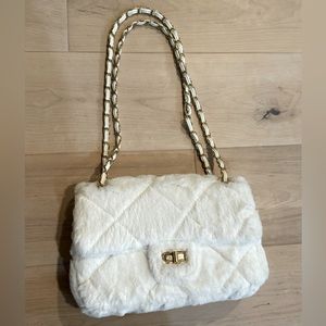 White faux fur bag with chained straps. Great condition. Only worn a few times!